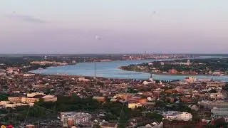 Aerial view of new orleans and Mississippi River at sunset, showcasing the city's unique