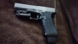 Close up of the Polymer 80 PF940V2 after stippling and XS Big Dot Sights installed