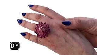 Helichrysum ring with epoxy resin.