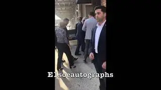 President Bill Clinton signing autographs