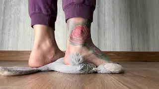 ASMR trample a soft toy. Bare feet.
