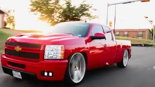Lowered Chevy Silverado 1500 Extended cab with tubs on 26s Gianelle wheels and a 8⁄10 drop