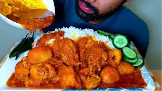 EATING SPICY CHICKEN CURRY WITH RICE AND CHILLI |