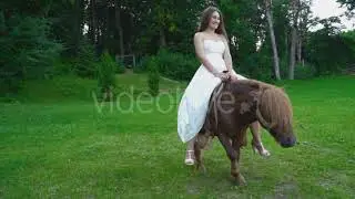 the Girl Is Riding a Pony | Stock Footage - Envato elements