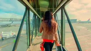 Girl walking to the plane - Copyright Free Video