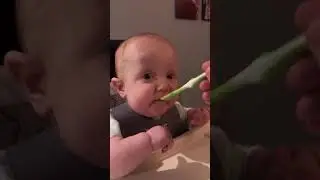 Baby eats Bananas (cutest gag wink ever)