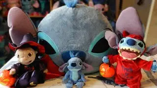 Some Stitch plushies and a cushion