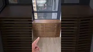 How to hide an air conditioner's outdoor unit on a balcony? 