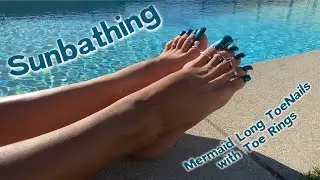 Sunbathing my long toenails with toe rings