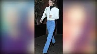Kendall Jenner keeps warm in a bright white cropped jacket and a black turtle neck for hockey