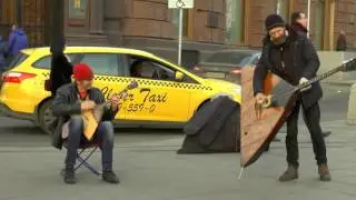 дуэт музыкантов. балалаечников.Там за речкой