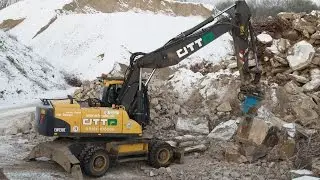 Volvo EW 230 C mit Oil Quick 80 zerkleinert Stahlbeton