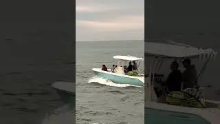 Beautiful boat heads out to sea at Haulover Inlet