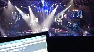 live show with lighting console in timecode connection with orchestra keyboard player