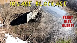 MASSIVE Blockage!!  Unclogging Lake Drain After Winter Storm - HUGE Debris Pile!  