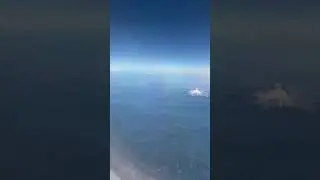 View of Mt Ranier, Mt Adams, and Mt Hood from the plane