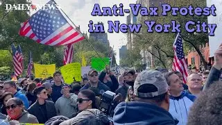 Anti-vaccination protestors chant 'Hold the Line' outside Gracie Mansion in New York City