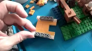 Assembling Minecraft Lego chicken set 21140