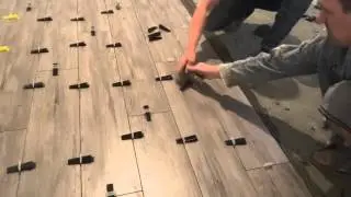 laying porcelain tiles on the floor quickly and efficiently.