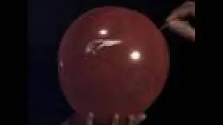 Air balloon popping in slow motion