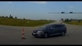 Lady blindly drives right into a traffic cone/pylon