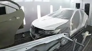 Toyota Camry with a scraped side.