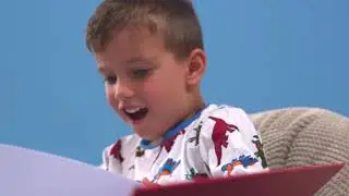 Michael Unwraps a Personalised Children's Book from In The Book