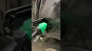 Gas Pump Malfunctions and Overflows as Person Tries to Pump Gas in Car - 1453979