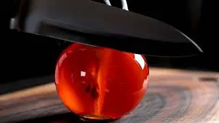 A cinematic shot in a hand in a matte black nitrile glove is precisely slicing perfect tomato, ASMR