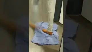 Unknown  woman trampling   shirt.