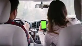 woman passenger using gps on smartphone during car journey soozgsmi