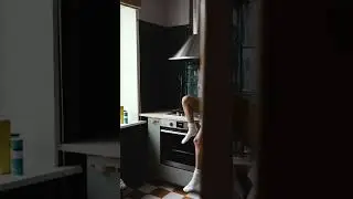 A Woman Eating on the Kitchen While Sitting Beside the Stove | Free Stock Video Footage HD 4K