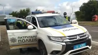 A beaten patrol car with a broken head on glass?!