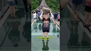 Elderly tourist breaks glass bridge in China