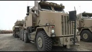 M1 Abrams Tanks being loaded into trucks for shipment out of Base ADDER, IRAQ