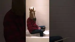 Man-horse playing Eagles of Death Metal on a bucket in a bathtub