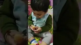 Eating orange for the first time.