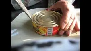 Large knife made from a spring. Opening a tin can.