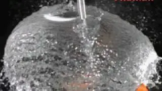 Super slow-motion popping of water balloon