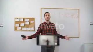 Math Teacher Explains Online Lesson To Students Using Marker and White Board | Stock Footage - E...