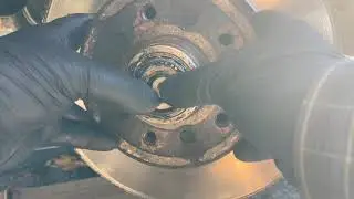 Taking the front wheel hub off, re install  and adjust the bearing clearance