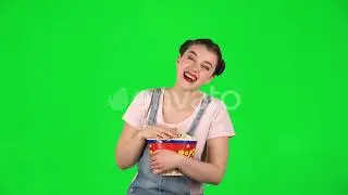 Sweet Girl Chews Popcorn While Watching a Movie and Laughing | Stock Footage - Envato elements