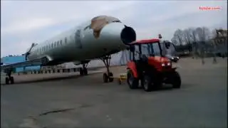 Tractor Belarus 320 and aircraft