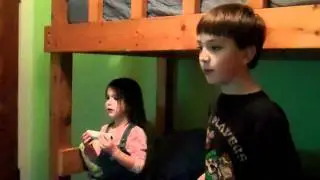 Brother helps little sister play new game on Wii!!!!!!!!!!