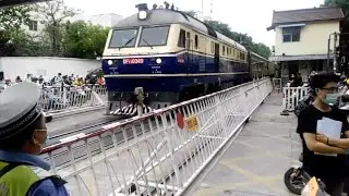 Passenger Train Pass Railway Crossing in Heavy Traffic of Nanjing City, China
