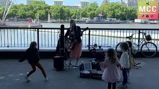 She sings the song “Let It Go” in the street and the children love it