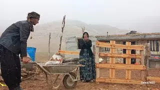 Nomadic life: a nomadic family in the mountains, building a shelter