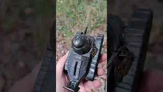 An antique piggy bank in the shape of a tank!