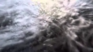 Toy boat falls down small waterfall