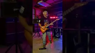 Playing along to a backing track of Livin’ After Midnight by Judas Priest.